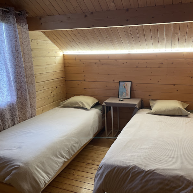 A bedroom with two beds